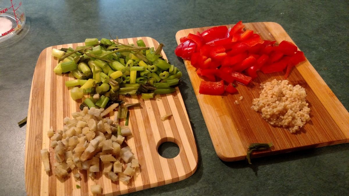 Chopped vegetables arranged on wooden cutting boards