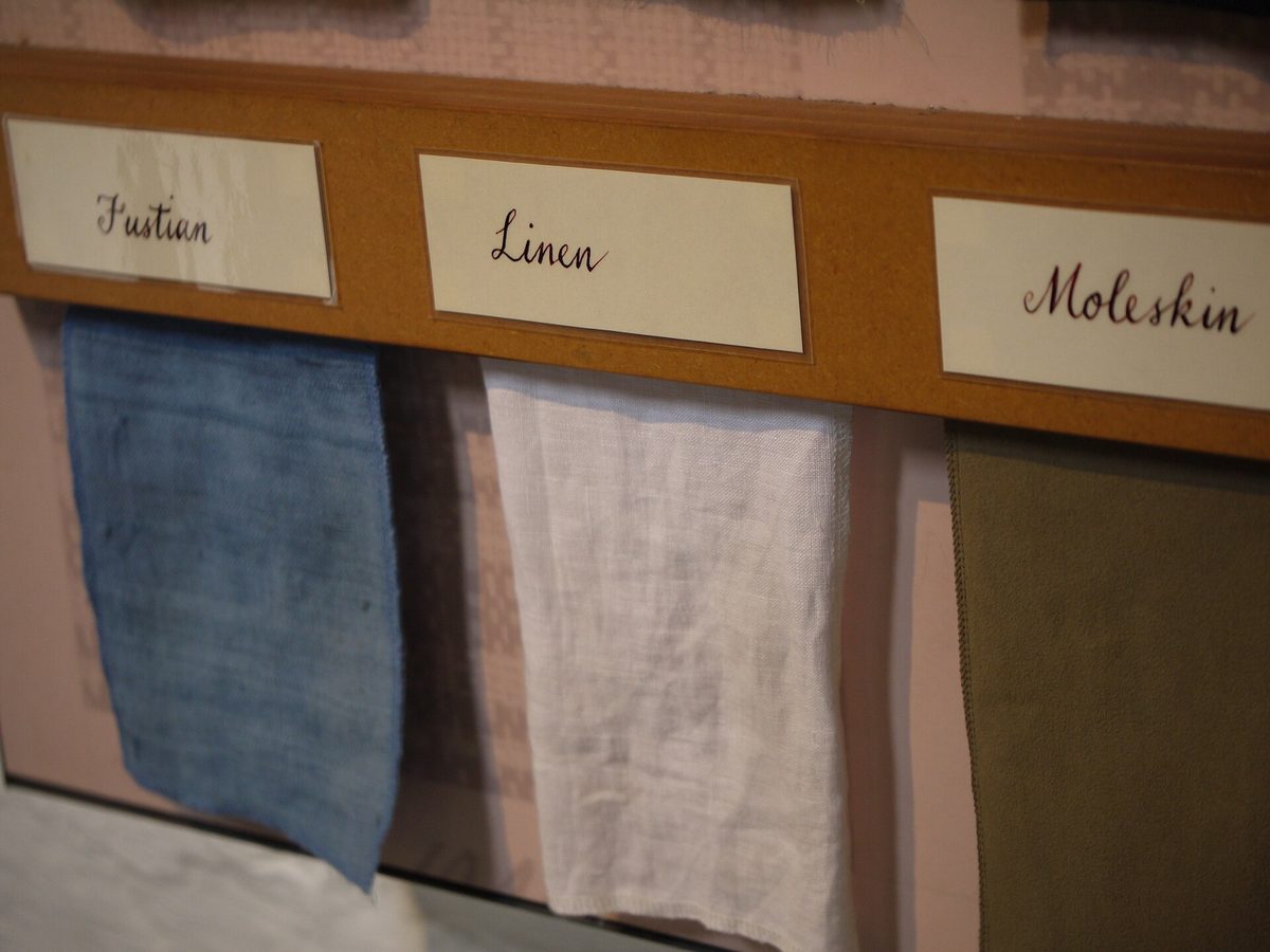 Fabric swatches on a display labeled with their material names